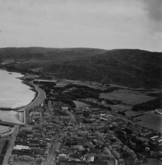 Campbeltown, general view, showing Kilkerran Road and Beinn Ghuilean.  Oblique aerial photograph taken facing south-east.  This image has been produced from a print.