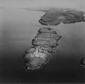 Lighthouse, Eilean Musdile and Tom na Faire, Lismore.  Oblique aerial photograph taken facing north-east.  This image has been produced from a print.