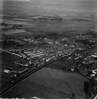 Coupar Angus, general view, showing George Street and Bogside Road.  Oblique aerial photograph taken facing north.  This image has been produced from a damaged print.