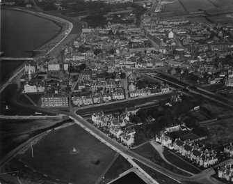 Largs, general view, showing Mackerston Place and Largs Station.  Oblique aerial photograph taken facing north.  This image has been produced from a print.