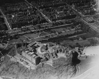 Edinburgh Castle and West Princes Street Gardens, Edinburgh.  Oblique aerial photograph taken facing north.  This image has been produced from a marked print.
