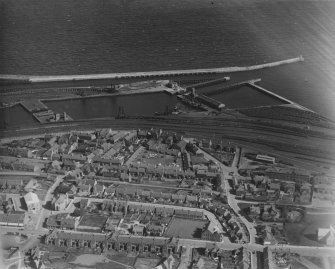 Methil, general view, showing Methil Docks and Bowling Green Street.  Oblique aerial photograph taken facing south-east.  This image has been produced from a print.