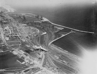 Methil, general view, showing Methil Docks and High Street.  Oblique aerial photograph taken facing east.  This image has been produced from a print.