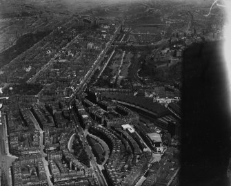Edinburgh, general view, showing Caledonian Station and Princes Street.  Oblique aerial photograph taken facing east.  This image has been produced from a marked print.