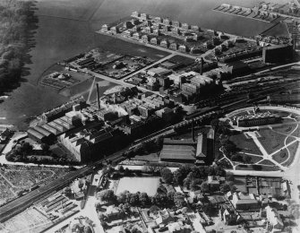 Kirkcaldy, general view, showing Barry, Ostlere and Shepherd Caledonia Linoleum Works, Station Road and Kirkcaldy Museum and Art Gallery.  Oblique aerial photograph taken facing north-west.  This image has been produced from a print.