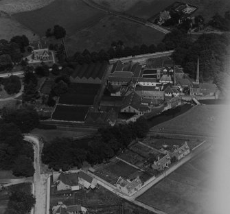 William Longmore Ltd. Strathisla Distillery, Seafield Avenue, Keith.  Oblique aerial photograph taken facing north-east.  This image has been produced from a print.