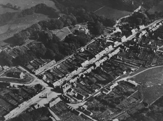 Creetown, general view, showing St John Street and Hill of Burns, High Road.  Oblique aerial photograph taken facing south-east.  This image has been produced from a print.