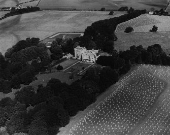 Comlongon Castle, Clarencefield.  Oblique aerial photograph taken facing north.  This image has been produced from a print.