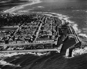 Lossiemouth, general view, showing Lossiemouth Harbour and Queen Street.  Oblique aerial photograph taken facing west.  This image has been produced from a print. 