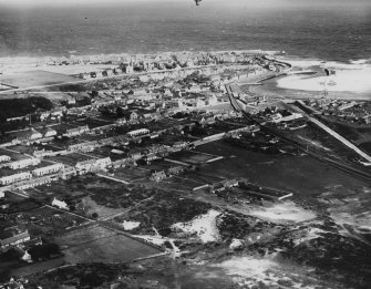 Lossiemouth, general view, showing Moray Street and Prospect Terrace.  Oblique aerial photograph taken facing north-east.  This image has been produced from a print. 