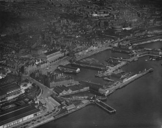 Dundee, general view, showing King William IV Dock and Caird Hall, City Square.  Oblique aerial photograph taken facing north.  This image has been produced from a print.