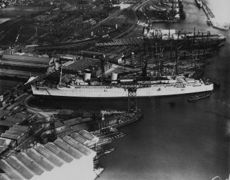 John Brown's Shipyard, Clydebank, Queen Mary under construction.  Oblique aerial photograph taken facing east.  This image has been produced from a print.