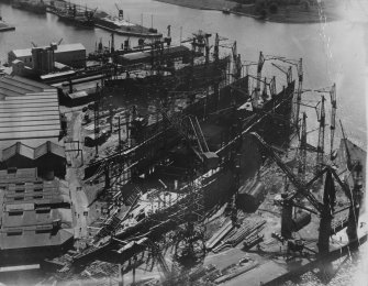 John Brown's Shipyard, Clydebank, Queen Elizabeth under construction.  Oblique aerial photograph taken facing south.  This image has been produced from a damaged print.