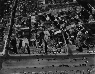 Largs, general view, showing St Columba's Parish Church, Gallowgate Street and Gallowgate Lane.  Oblique aerial photograph taken facing east.  This image has been produced from a print.