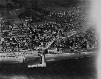Largs, general view, showing Clark Memorial Church, Bath Street and Largs Pier.  Oblique aerial photograph taken facing east.  This image has been produced from a print.
