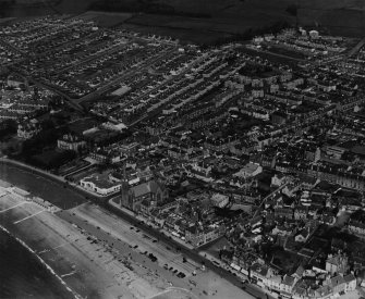 Largs, general view, showing St Columba's Parish Church, Gallowgate Street and Kelvin Street.  Oblique aerial photograph taken facing north-east.  This image has been produced from a print.
