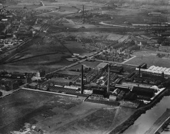 Rutherglen, general view, showing Clyde Paper Co. Ltd. Clyde Paper Mills, Eastfield and Farmeloan Road.  Oblique aerial photograph taken facing west.  This image has been produced from a print. 