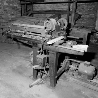 Workshop, Basement: Detail of electrically-powered White of Paisley grinding machine

