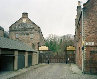 General view from south east of gates to cabinet works, from Belford Mews
