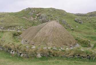 General view of the reconstructed house, taken from the west.