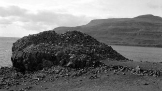 General view of the dun at Kraiknish, taken from the SE. The figure in the foreground is probably RCAHMS archaeologist J Graham Callander.