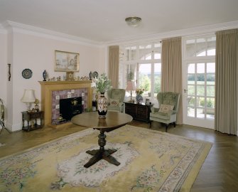 Interior. Ground floor. Living Hall. View from NW showing fireplace and glazed screen to loggia