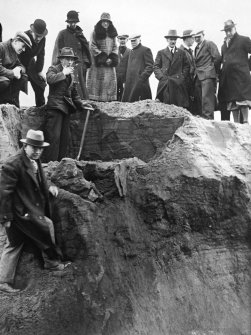 Group of twelve people around excavation. Ludovic Mann is the gentleman at the lower left of the photograph.