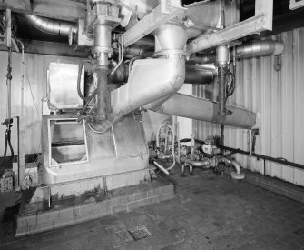 View of two PETN Nitrators, feeding diverter, from which pipes lead either to the Nitration Filter or (right), to the drowning tank if there is a problem withthe batch	