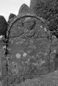 View of headstone commemorating John Doig (died 1780) with large winged soul.