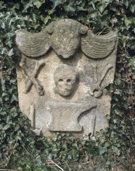  View of headstone with anvil, pincers and hammers, Cockburnspath Churchyard