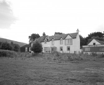View from N showing two storey additions facing the loch
