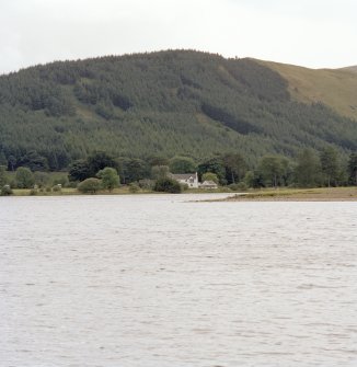 Distant view from NW showing lochside setting