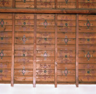 Interior. Timber boarded ceiling with stencil decoration
