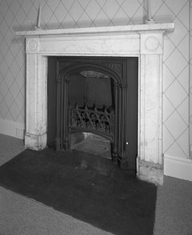 Interior. First Floor central block bedroom fireplace
