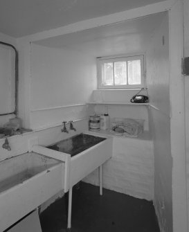 Interior. Basement utility room with belfast sinks