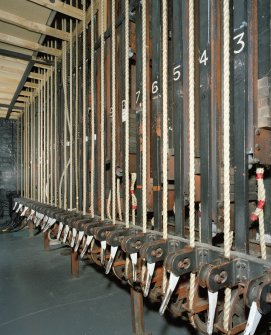 Interior.  Backstage, detail of fly ropes at lower level