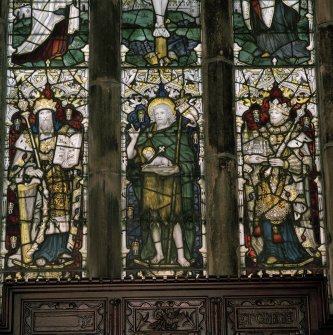 Interior. Detail of E stained glass window medieval tracery with stained glass by C E Kempe
