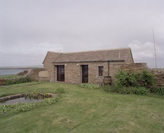 View of garden outbuilding from W