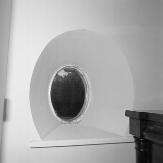 Interior. First floor. Central bedroom. Detail of oval window.