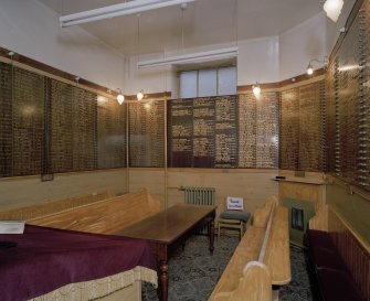 Interior. 'Mini' Synagogue in W corner showing memorial walls