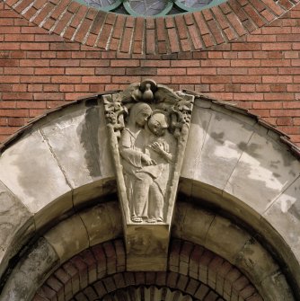 W front. Entrance. Detail of Madonna and child keystone