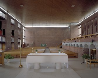 Interior. View from altar towards rear showing concrete corbel course to right