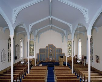 Interior. View from W from gallery showing the communion table and platform