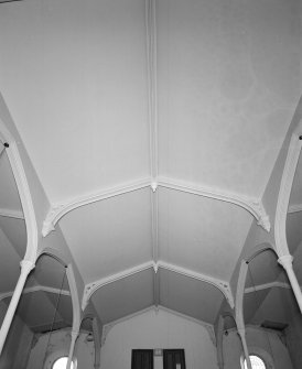 Interior. View of roof showing trusses and columns