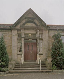 I.P.C.U. Building. View from W. Detail of main door