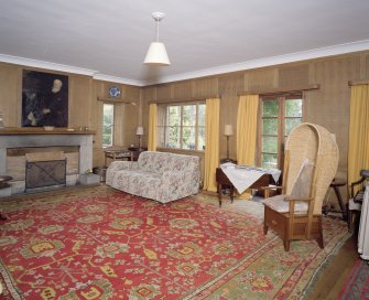 Interior. View of panelled lounge hall from NW showing french doors to garden terrace