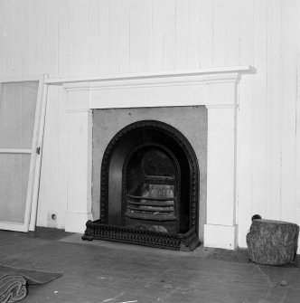 Interior. Detail of fireplace in rear bedroom in Victorian wing