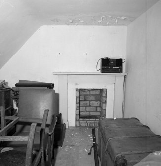 Interior. Detail of attic fireplace in rear wing