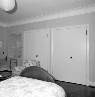 Interior. Detail of fitted wardrobes in SE bedroom