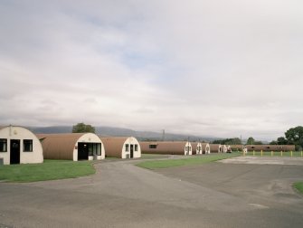 View from SW of R & F accommodation (huts 41-43, 61-5), NAAFI (65)